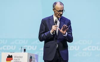 epa11913808 Christian Democratic Union (CDU) party Chairman Friedrich Merz speaks during election campaign event in Oberhausen, Germany, 21 February 2025. Germany will hold early federal elections on 23 February 2025 to elect a new Bundestag (parliament).  EPA/RONALD WITTEK