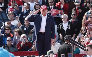 epa11224762 Former US president Donald J. Trump salutes as he delivers a speech at the Buckeye Values PAC Rally presidential election campaign in Vandalia, Ohio, USA, 16 March 2024.  EPA/MARK LYONS