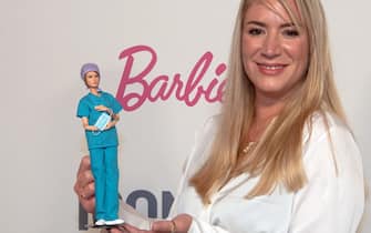 14 October 2021, Berlin: Nurse Franziska Böhler is delighted to receive the Iconista Prize 2021, a unique Barbie modelled on her by Mattel. The nurse is honored for her extraordinary commitment during the Corona pandemic. With the prize, Iconist, the digital lifestyle offering of the "Welt", together with Mattel, honors women for special achievements. Photo: Paul Zinken/dpa (Photo by Paul Zinken/picture alliance via Getty Images)