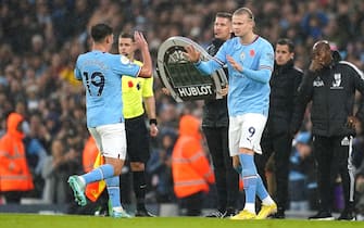 Manchester City's Erling Haaland (right) comes on for the substituted Julian Alvarez during the Premier League match at the Etihad Stadium, Manchester. Picture date: Saturday November 5, 2022.