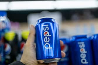SHAOXING, CHINA - MARCH 09: A customer holds a can of Pepsi beverage at a shopping mall on March 9, 2022 in Shaoxing, Zhejiang Province of China. (Photo by VCG/VCG via Getty Images)