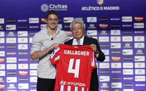 epa11561339 English midfielder Conor Gallagher (L) poses next to Atletico Madrid's president, Enrique Cerezo (R) during his official presentation as new Atletico Madrid player at a press conference in Madrid, central Spain, 23 August 2024.  EPA/Chema Moya