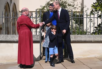 epa10566178 Britain's William, Prince of Wales and his son Prince Louis (C) depart the Easter Sunday service at St Georges Chapel at Windsor Castle in Windsor, Britain, 09 April 2023.  EPA/NEIL HALL