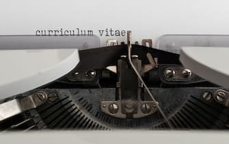 close-up of words CURRICULUM VITAE written on old mechanical typewriter