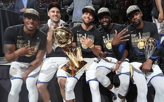 CLEVELAND, OH - JUNE 8: Andre Iguodala #9, Klay Thompson #11, Stephen Curry #30, Draymond Green #23, and Kevin Durant #35 of the Golden State Warriors pose with the Larry O'Brien Championship Trophy after Game Four of the 2018 NBA Finals against the Cleveland Cavaliers on June 8, 2018 at Quicken Loans Arena in Cleveland, Ohio. NOTE TO USER: User expressly acknowledges and agrees that, by downloading and/or using this photograph, user is consenting to the terms and conditions of the Getty Images License Agreement. Mandatory Copyright Notice: Copyright 2018 NBAE (Photo by Nathaniel S. Butler/NBAE via Getty Images)