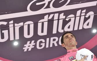 Spanish rider Alberto Contador celebrates on the podium after winning the 98th of Giro d\