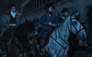 Paul Barras (TAHAR RAHIM, left) and Napoleon (JOAQUIN PHOENIX, center) prepair to launch the night attack in Apple Original Films NAPOLEON, released theatrically by Columbia Pictures.