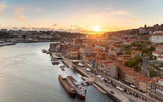 panoramic view of the city of Oporto and the Douro river in Portugal at the sunset