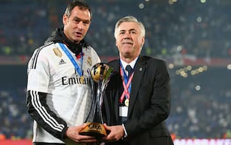 MARRAKECH, MOROCCO - DECEMBER 20:  Head coach Carlo Ancelotti (R) of Real Madrid celebrates with the trophy after the FIFA Club World Cup Final between Real Madrid and San Lorenzo at Marrakech Stadium on December 20, 2014 in Marrakech, Morocco.  (Photo by Ian Walton - FIFA/FIFA via Getty Images)