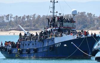 The fishing boat carrying about 600 migrants rescued in recent days 100 miles off the coast of Sicily towed by a tugboat arrived in the port of Catania, Italy, 12 April 2023. The vessel was escorted by the 'Nave Peluso' of the Coast Guard. The migrants on board greeted their arrival with applause and whistles and shouts of 'Bella Italia'.
ANSA/ ORIETTA SCARDINO
