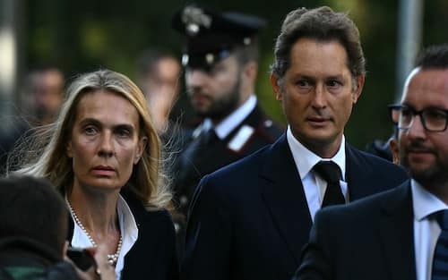 John Elkann and his wife Lavinia Borromeo arrive to pay their respects to late Italian fashion designer Giorgio Armani who will lie-in state for two days at the Armani Theatre in Milan, on September 6, 2025. Giorgio Armani died on September 4, 2025 at 91. (Photo by Stefano RELLANDINI / AFP)