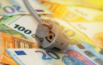 Electric plug on euro banknotes