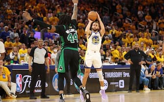 SAN FRANCISCO, CALIFORNIA - JUNE 13: Stephen Curry #30 of the Golden State Warriors shoots a three point basket against Robert Williams III #44 of the Boston Celtics during the fourth quarter in Game Five of the 2022 NBA Finals at Chase Center on June 13, 2022 in San Francisco, California. NOTE TO USER: User expressly acknowledges and agrees that, by downloading and/or using this photograph, User is consenting to the terms and conditions of the Getty Images License Agreement. (Photo by Ezra Shaw/Getty Images)