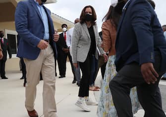 MIAMI GARDENS, FLORIDA - OCTOBER 31: Democratic Vice Presidential Nominee Sen. Kamala Harris (D-CA) shows off her shoes after a person inquired about them during a stop at Buccaneer Park on October 31, 2020 in Miami Gardens, Florida. Harris continues to campaign before the November 3rd election day. (Photo by Joe Raedle/Getty Images)