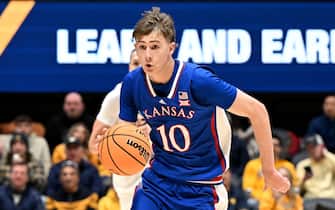 MORGANTOWN, WEST VIRGINIA - JANUARY 20: Johnny Furphy #10 of the Kansas Jayhawks handles the ball against the West Virginia Mountaineers at WVU Coliseum on January 20, 2024 in Morgantown, West Virginia. (Photo by G Fiume/Getty Images)