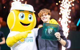 ROTTERDAM, NETHERLANDS - FEBRUARY 18: Jannik Sinner of Italy is seen posing with mascotte and with his trophy after winning the tournament during Day 7 of the ABN AMRO Open 2024 at Ahoy on February 18, 2024 in Rotterdam, Netherlands. (Photo by Joris Verwijst/BSR Agency/Getty Images)