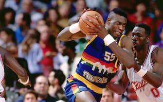 LOS ANGELES - 1991:  Dikembe Mutombo #55 of the Denver Nuggets drives to the basket against the Los Angeles Clippers during an NBA game in 1991 at the Los Angeles Memorial Sports Arena in Los Angeles, California.  NOTE TO USER: User expressly acknowledges and agrees that, by downloading and/or using this Photograph, user is consenting to the terms and conditions of the Getty Images License Agreement.  Mandatory Copyright Notice: Copyright 1991 NBAE (Photo by Jon SooHoo/NBAE via Getty Images) *** Local Caption *** Dikembe Mutombo 