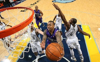 MEMPHIS, TN - JANUARY 3: Isaiah Thomas #22 of the Sacramento Kings drives to the basket around Sam Young #4 of the Memphis Grizzlies on January 3, 2012 at FedExForum in Memphis, Tennessee.  NOTE TO USER: User expressly acknowledges and agrees that, by downloading and or using this photograph, User is consenting to the terms and conditions of the Getty Images License Agreement. Mandatory Copyright Notice: Copyright 2012 NBAE (Photo by Joe Murphy/NBAE via Getty Images)
