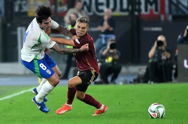 Italy's Sandro Tonali (L) vies for the ball with Belgium's Leandro Trossard during the UEFA Nations League group A2 soccer match between Italy and Belgium at the Olimpico Stadium in Rome, Italy, 10 October 2024. ANSA/ETTORE FERRARI