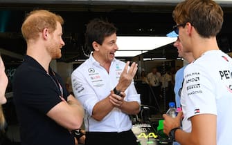 CIRCUIT OF THE AMERICAS, UNITED STATES OF AMERICA - OCTOBER 22: Prince Harry, talks with Toto Wolff, Team Principal and CEO, Mercedes-AMG, and George Russell, Mercedes-AMG, outside of the Mercedes garage during the United States GP at Circuit of the Americas on Sunday October 22, 2023 in Austin, United States of America. (Photo by Mark Sutton / Sutton Images)
