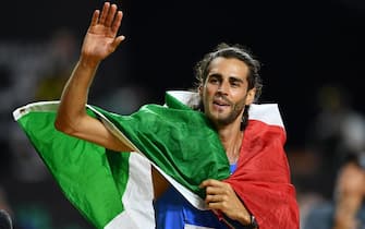 Gianmarco Tamberi of Italy celebrates after winning the Men's High Jump final at the World Athletics Championships Budapest, Hungary, 22 August 2023. ANSA/Adam Warzawa  POLAND OUT