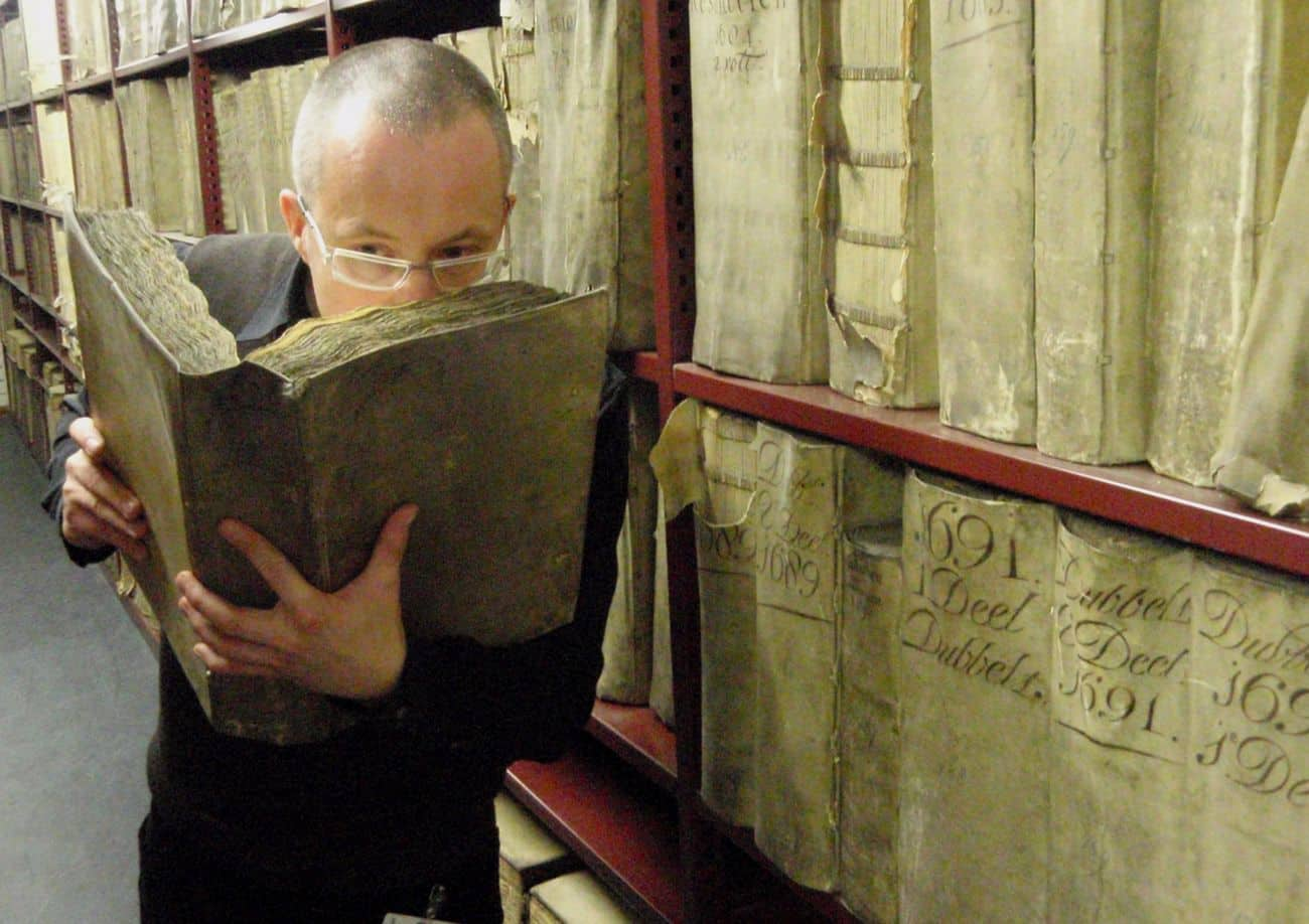 Prof.-Matija-Strlic-smelling-a-historic-book-in-the-National-Archives-of-The-Netherlands-©-Matija-Strlic.jpg