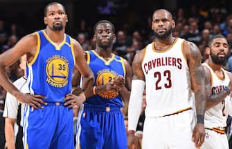 CLEVELAND, OH - JUNE 9:  Kevin Durant #35 and Draymond Green #23 of the Golden State Warriors and LeBron James #23 of the Cleveland Cavaliers during Game Four of the 2017 NBA Finals on June 9, 2017 at Quicken Loans Arena in Cleveland, Ohio. NOTE TO USER: User expressly acknowledges and agrees that, by downloading and/or using this photograph, user is consenting to the terms and conditions of Getty Images License Agreement. Mandatory Copyright Notice: Copyright 2017 NBAE (Photo by Andrew D. Bernstein/NBAE via Getty Images)
