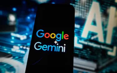 POLAND - 2024/03/23: In this photo illustration a Google Gemini logo is displayed on a smartphone with Artificial Intelligence symbol on the background. (Photo Illustration by Omar Marques/SOPA Images/LightRocket via Getty Images)