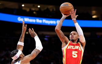 ATLANTA, GEORGIA - OCTOBER 30:  Dejounte Murray #5 of the Atlanta Hawks hits a basket against Nickeil Alexander-Walker #9 of the Minnesota Timberwolves during the third quarter at State Farm Arena on October 30, 2023 in Atlanta, Georgia.  NOTE TO USER: User expressly acknowledges and agrees that, by downloading and/or using this photograph, user is consenting to the terms and conditions of the Getty Images License Agreement.  (Photo by Kevin C. Cox/Getty Images)