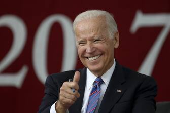 epaselect epa05987930 Former US Vice President Joe Biden sits on stage before delivering the Class Day address at Harvard University in Cambridge, Massachusetts, USA 24 May 2017.  EPA/LISA HORNAK