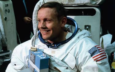 (Original Caption) Space Center, Houston: Astronaut Neil A. Armstrong, in training for the projected Apollo 11 lunar landing mission, is being suited up for the first full dress rehearsal of activities he is to perform during the projected moon landing.