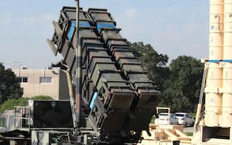 Israeli soldiers walk near an Israeli Irone Dome defence system (L), a surface-to-air missile (SAM) system, the MIM-104 Patriot (C), and an anti-ballistic missile the Arrow 3 (R) during Juniper Cobra's joint exercise press briefing at Hatzor Israeli Air Force Base in central Israel, on February 25, 2016. - Juniper Cobra, is held every two years where Israel and the United States train their militaries together to prepare against possible ballistic missile attacks, as well as allowing the armies to learn to better work together. (Photo by GIL COHEN-MAGEN / AFP) (Photo by GIL COHEN-MAGEN/AFP via Getty Images)
