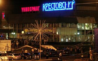 This picture shows general view of the blast site near the shopping centre Krestovsky, close to Rizhskaya subway station in Moscow, 31 August 2004. Ten people were killed Thursday in an explosion outside a Moscow subway station shortly after rush hour, a spokesman for Russia's FSB security service said. The spokesman, Sergei Ignatchenko, said 33 people were injured in the blast. Another official spoke of 37 hurt. The sign reads "Krestovsky stores".          AFP PHOTO      DENIS SINYAKOV (Photo credit should read DENIS SINYAKOV/AFP via Getty Images)