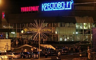 This picture shows general view of the blast site near the shopping centre Krestovsky, close to Rizhskaya subway station in Moscow, 31 August 2004. Ten people were killed Thursday in an explosion outside a Moscow subway station shortly after rush hour, a spokesman for Russia's FSB security service said. The spokesman, Sergei Ignatchenko, said 33 people were injured in the blast. Another official spoke of 37 hurt. The sign reads "Krestovsky stores".          AFP PHOTO      DENIS SINYAKOV (Photo credit should read DENIS SINYAKOV/AFP via Getty Images)