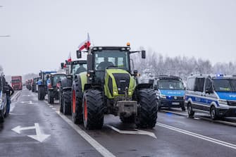 Farmers with tractors are seen on February 9, 2024 blocking access to the Polish-Ukrainian border crossing in Dorohusk, eastern Poland, during a farmers' protest across the country against EU politics and Ukrainian agricultural products allowed on EU market at low prices. (Photo by Wojtek Radwanski / AFP) (Photo by WOJTEK RADWANSKI/AFP via Getty Images)