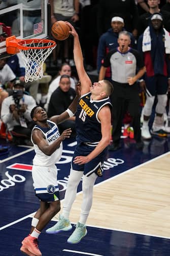 MINNEAPOLIS, MN -  MAY 12: Nikola Jokic #15 of the Denver Nuggets dunks the ball during the game against the Minnesota Timberwolves during Round Two Game Four of the 2024 NBA Playoffs on May 12, 2024 at Target Center in Minneapolis, Minnesota. NOTE TO USER: User expressly acknowledges and agrees that, by downloading and or using this Photograph, user is consenting to the terms and conditions of the Getty Images License Agreement. Mandatory Copyright Notice: Copyright 2024 NBAE (Photo by Jordan Johnson/NBAE via Getty Images)