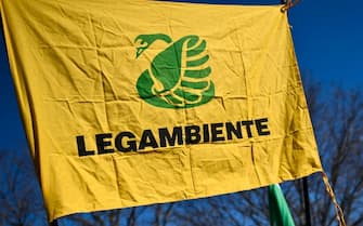 TRINO VERCELLESE, ITALY - FEBRUARY 3: Man holds a Legambinte flag during the protest against Nuclear Waste Site on February 3, 2024 in Trino Vercellese, Italy. Around three hundred people participated today in the demonstration promoted by Legambiente against the candidature of the municipal administration of Trino Vercellese to host the single national radioactive waste repository. The protest started from Lucedio, one of the rice-growing areas of excellence in Piedmont, and then moved under the cooling towers of the former Galileo Ferraris nuclear power plant in Leri Cavour, converted to power plant use in 1987 after the Italian referendum which abolished the use of nuclear energy in Italy which is a candidate to host the single national repository for radioactive waste. (Photo by Stefano Guidi/Getty Images)