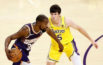 epa10941949 Phoenix Suns forward Kevin Durant (L) in action against Los Angeles Lakers guard Austin Reaves during the second quarter of the NBA game between the Phoenix Suns and the Los Angeles Lakers at Crypto.com Arena in Los Angeles, California, USA, 26 October 2023.  EPA/ETIENNE LAURENT  SHUTTERSTOCK OUT