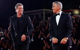 US actor George Clooney (R) and US actor Brad Pitt arrive for the premiere of  Wolfs  at the 81st annual Venice International Film Festival, in Venice, Italy, 01 September 2024. The movie is presented out of competition at the festival running from 28 August to 07 September 2024.  ANSA/FABIO FRUSTACI
