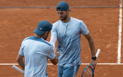 Simone Bolelli and Andrea Vavassori are giving a high five to each other during their match against Fabian Marozsan and Fernando Romboli at Roland Garros Grand Slam Tournament in Paris, France, on May 31, 2024. (Photo by Robert Szaniszlo/NurPhoto via Getty Images)