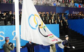 The Olympic flag is raised during the opening ceremony of the Paris 2024 Olympic Games at the Trocadero in Paris, in France. Picture date: Friday July 26, 2024.