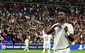 Real Madrid's Brazilian forward Vinicius Junior celebrates scoring the opening goal during the UEFA Champions League final football match between Liverpool and Real Madrid at the Stade de France in Saint-Denis, north of Paris, on May 28, 2022. (Photo by JAVIER SORIANO / AFP) (Photo by JAVIER SORIANO/AFP via Getty Images)