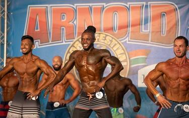 epa10638610 Athletes compete in the Men's Physique section of the Arnold Classic Africa multi-sport festival, held in Johannesburg, South Africa, 19 May 2023. The festival sees athletes competing in 45 different sports and events. Initiated by former Austrian body builder Arnold Schwarzenegger, the sports festival does not only present body building shows but also classes and competitions in categories from Arm-Wrestling to Zumba.  EPA/KIM LUDBROOK