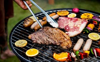 Closeup of barbecues steaks on the charcoals grill