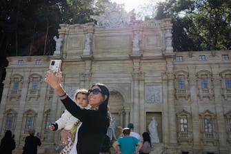 epa10634883 Tourists visit the replica of the iconic Fontana di Trevi, built to honor Italian immigrants and boost tourism, in the city of Serra Negra, Brazil, 17 May 2023. The Serra Negra Fountain occupies an area of 370 square meters and is 11 meters high, from the water mirror, and 20.7 meters wide.  EPA/ISAAC FONTANA