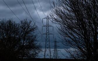 BATH, UNITED KINGDOM - FEBRUARY 28: Electrical pylons carry electricity cables across fields on February 28, 2023 near Bath, England. (Photo by Matt Cardy/Getty Images)