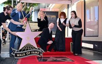US actor Macaulay Culkin reacts as his Hollywood Walk of Fame Star is unveiled on December 1, 2023 in Hollywood, joined by Canadian-US actress Catherine O'Hara (C) and US actress Natasha Lyonne (2nd R). (Photo by Frederic J. BROWN / AFP)