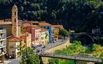 Elevated panoramic view of small Ligurian town Badalucco located by Argentina river. Badalucco is a comune in province of Imperia in Liguria. Italy.