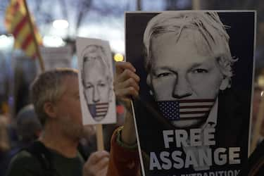 BARCELONA, SPAIN - FEBRUARY 20: A person holds a banner that reads "Free Assange" in front of the UK consulate to protest against the extradition of Julian Assange to the USA on February 20, 2024 in Barcelona, Spain. The two-day hearing in London determines whether Julian Assange can appeal against the extradition order approved by then-Home Secretary Priti Patel in June 2022. The WikiLeaks founder is facing life imprisonment in the US for publishing thousands of classified military and diplomatic documents in 2010, which were provided by US army whistleblower Chelsea Manning. Between 2012 and 2019, Assange received asylum in Ecuador on the grounds of political persecution. Since 2019, he has been held at London's Belmarsh Prison as the US extradition case has proceeded.