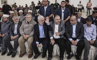 Yahya Sinwar (C), leader of the Palestinian Hamas Islamist movement in the Gaza Strip attends a meeting with people at a hall on the sea side of Gaza City.